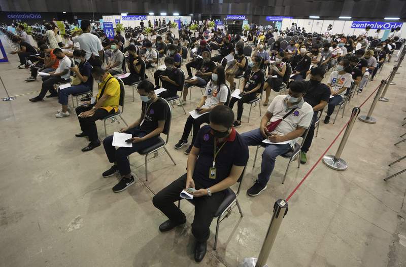 Thailand reports record virus cases; delays Bangkok easing