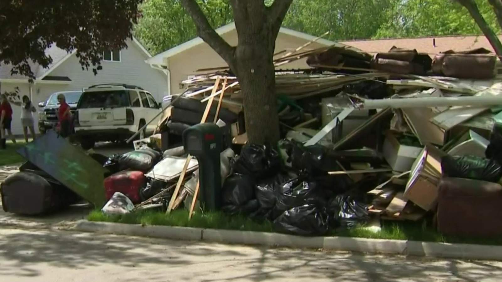 Debris line neighborhoods in mid-Michigan as community deals with damage from devastating floods