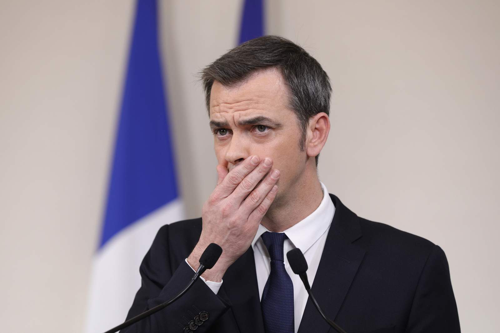 French police search homes of health minister, ex-PM
