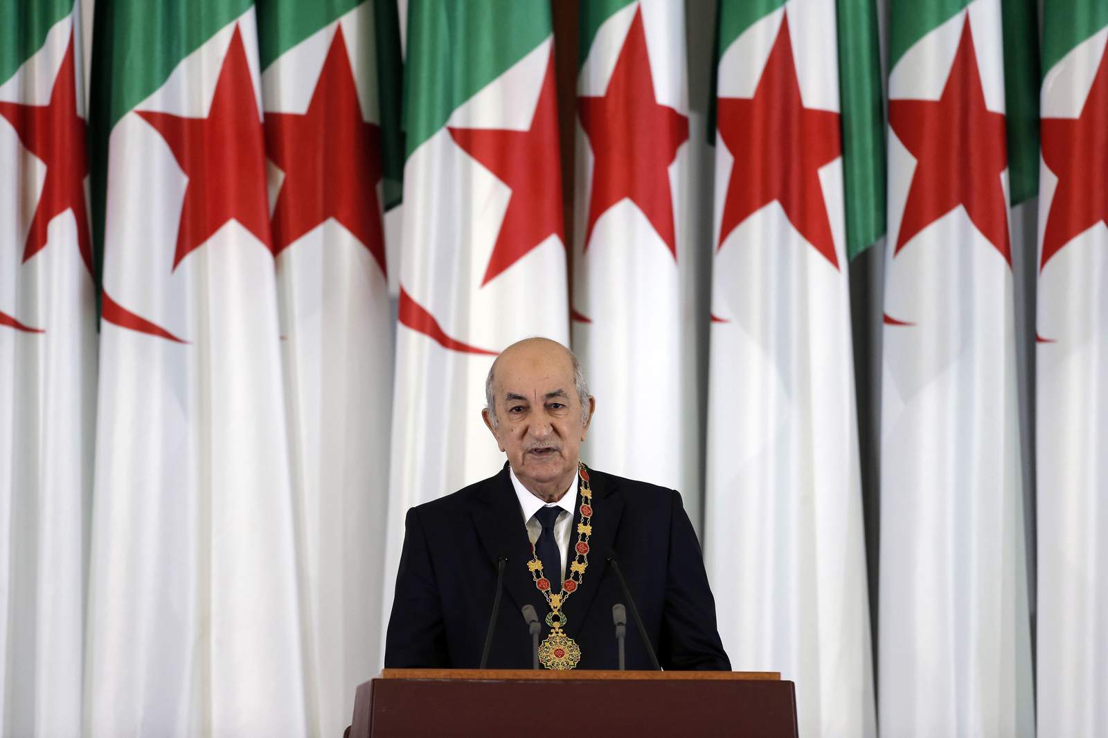 After battling virus, Algerian leader suddenly reappears