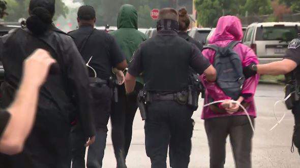 Detroit police arrest protesters blocking buses from picking up kids for summer school