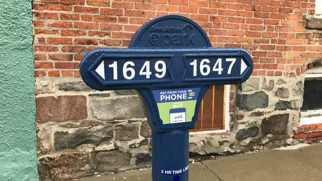 Red meter bags now designate quick pickup parking spaces in Ann Arbor