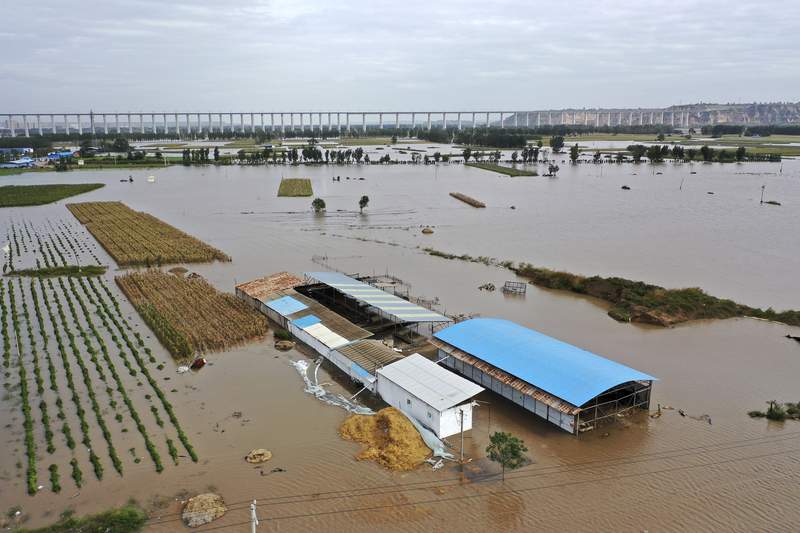 Bus plunge, floods leave 29 dead in northern China