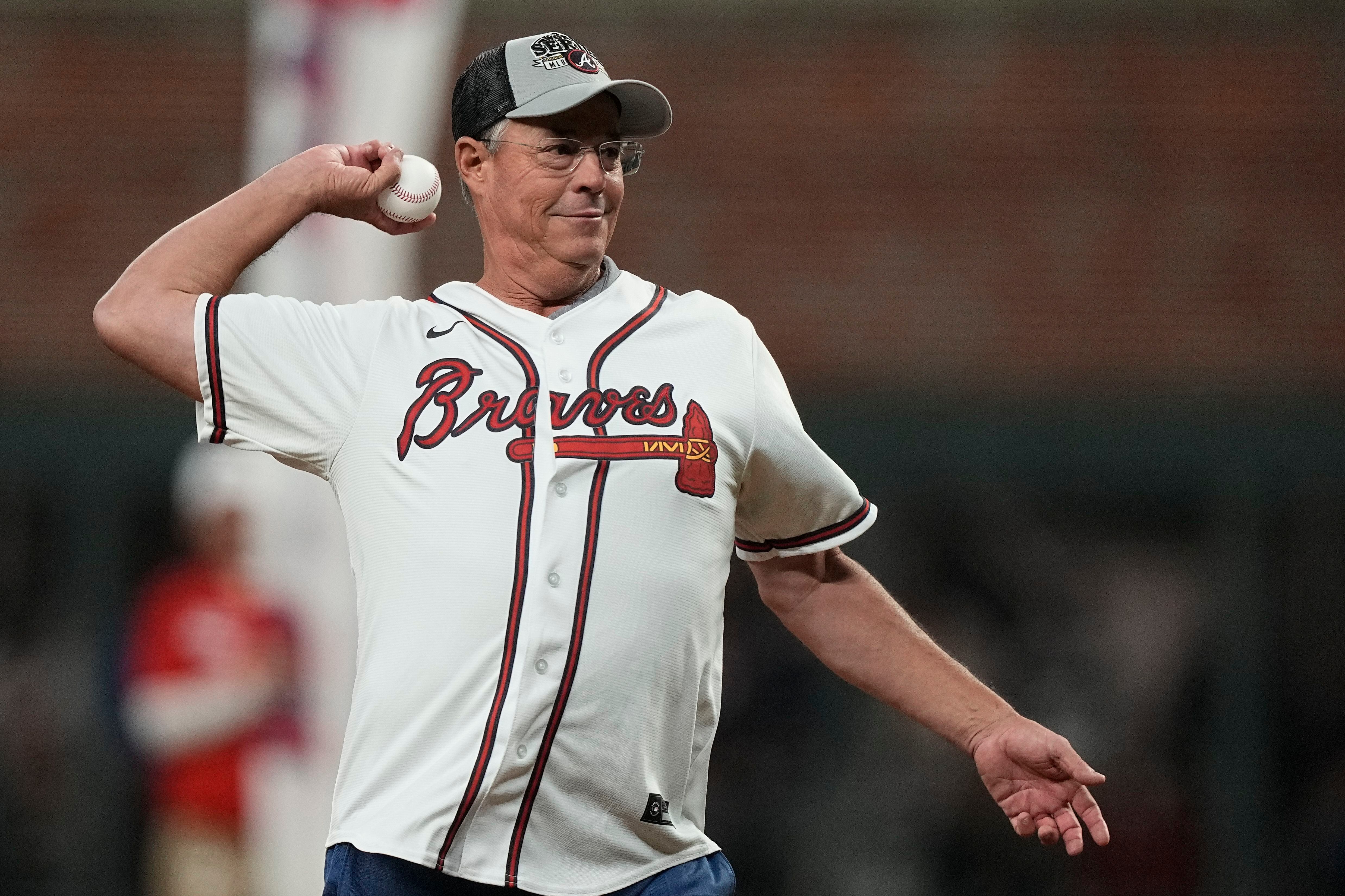 Former Atlanta Braves pitcher Greg Maddux reacts as his jersey is retired  before the Braves game against the New York Mets at Turner Field in  Atlanta, Georgia, Friday, July 17, 2009. (Photo