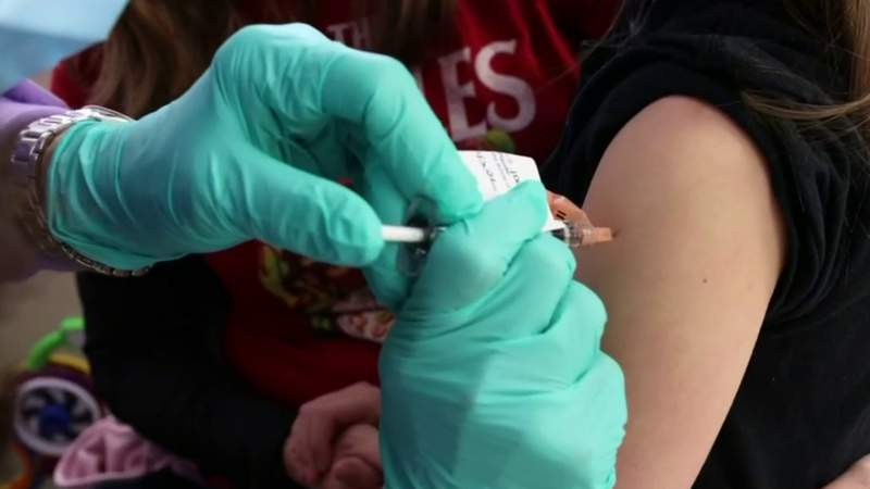 Should an 11-year-old get the lower COVID vaccine dose?