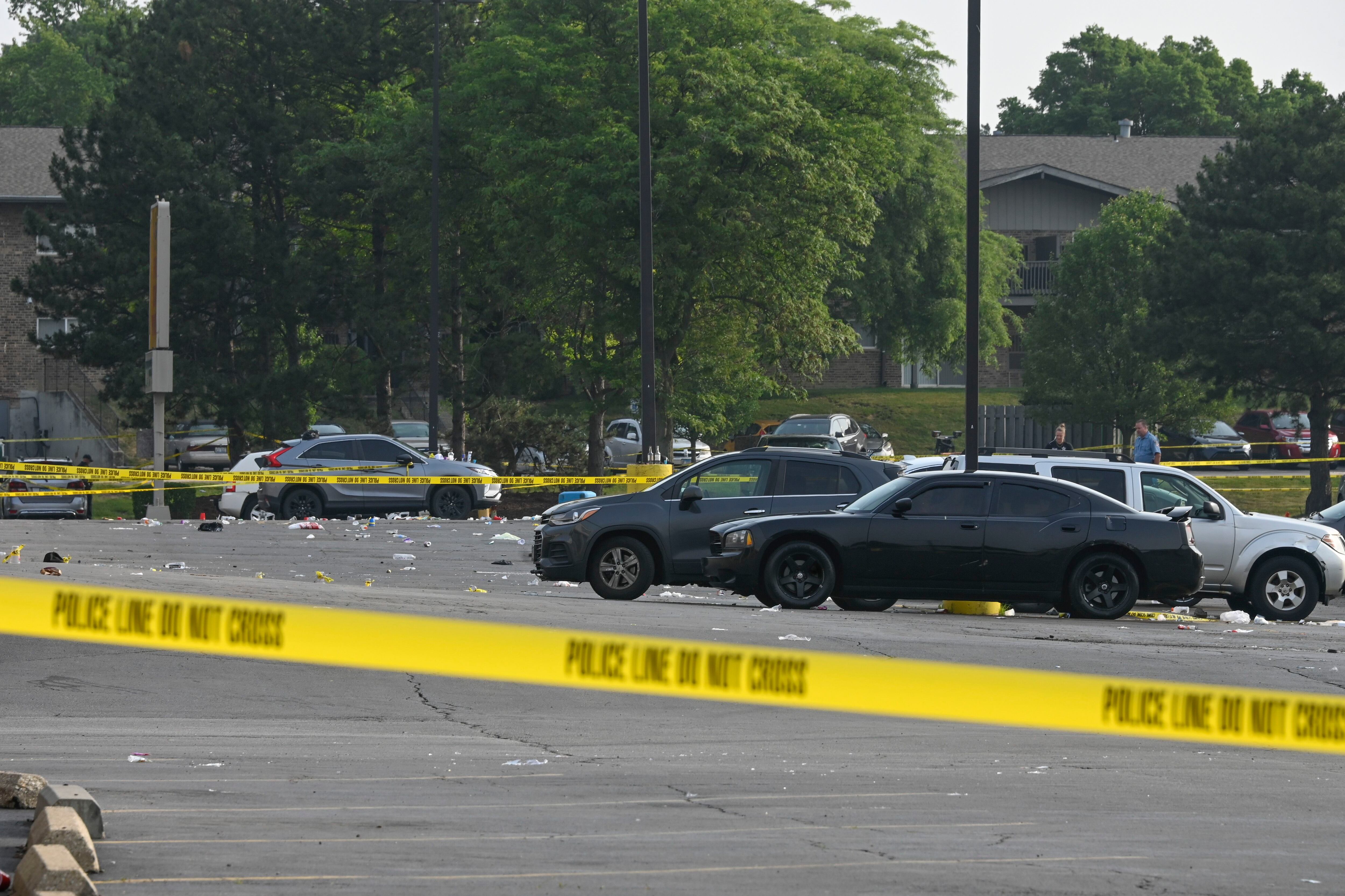 Parking lot party shooting leaves 1 dead and at least 22 people