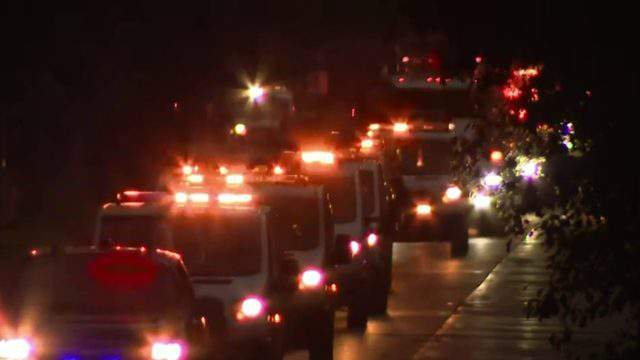 Tow truck drivers gather en masse to honor driver killed last May in I-94 crash