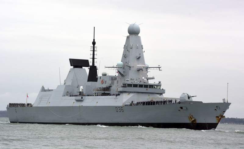 Russia says warning shots deter UK warship; London denies it