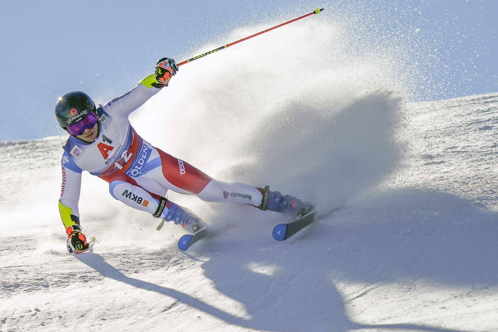 Swiss skier Caviezel has slim 1st-run lead in season opener