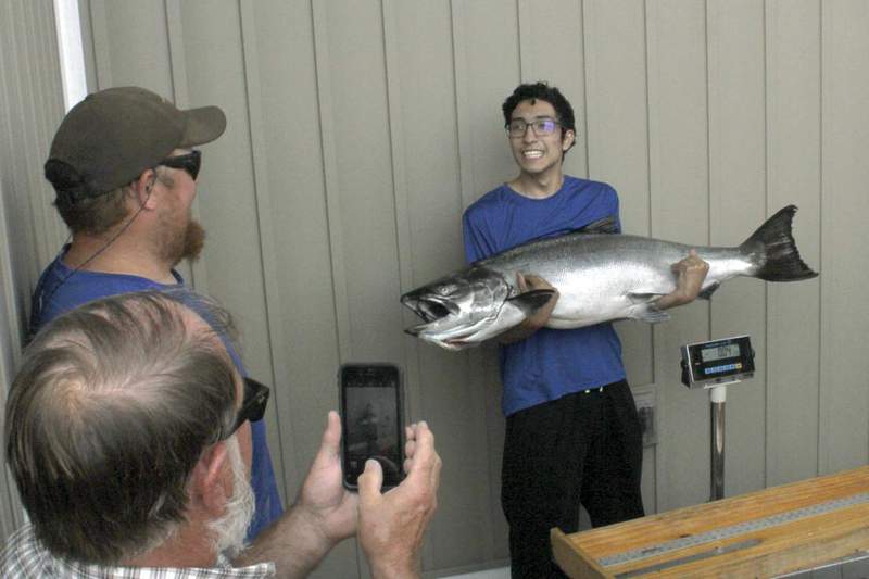 ‘First 10 minutes were quite a fight’: Michigan teen sets new salmon record