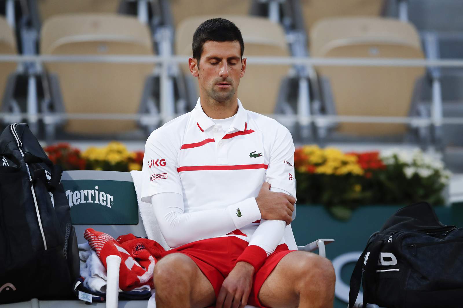 Djokovic deals with arm issue in Paris; gets Tsitsipas in SF