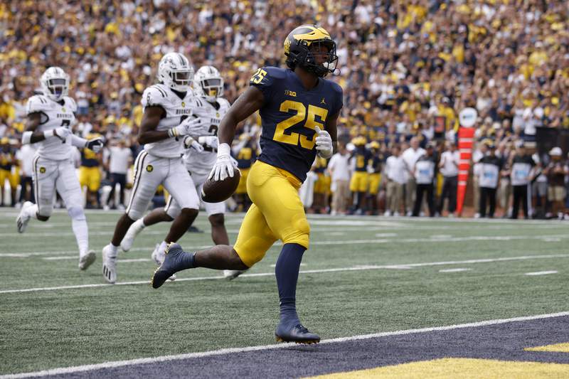 Michigan, Washington meet with a lot to prove in prime time