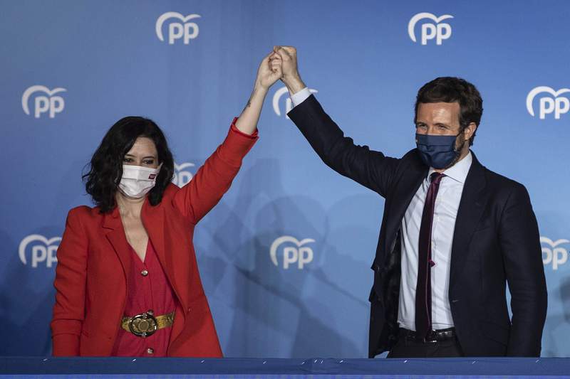 Madrid's champion of soft virus restrictions wins election