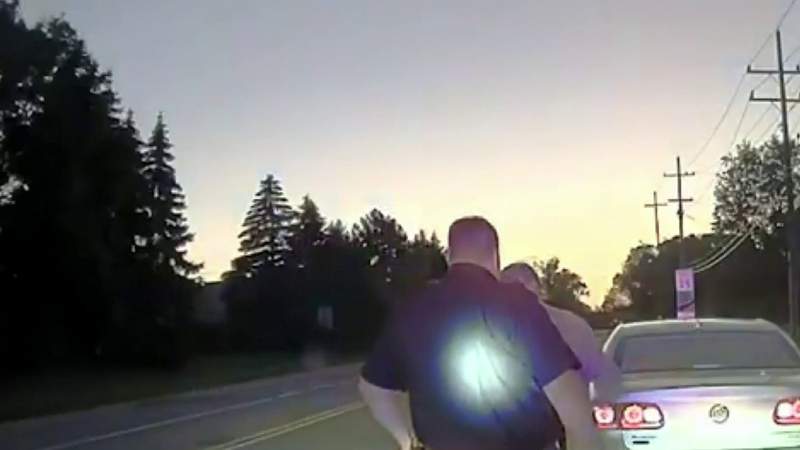 Sterling Heights police officers help man hook up new TV after pulling him over for speeding