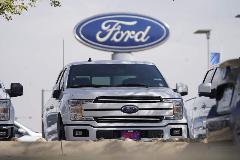 Ford posts profit, says chip shortage may cut production 50%
