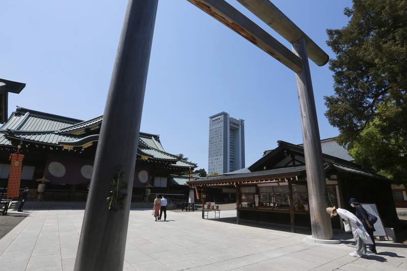 Japan's Suga makes offering at war shrine but doesn't visit