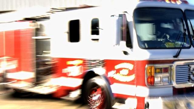 Woman escapes Shelby Township house fire, son dies