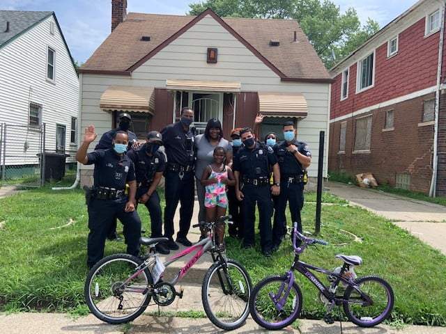 Detroit police officers fulfill promise of getting new bikes for sisters who were sharing one
