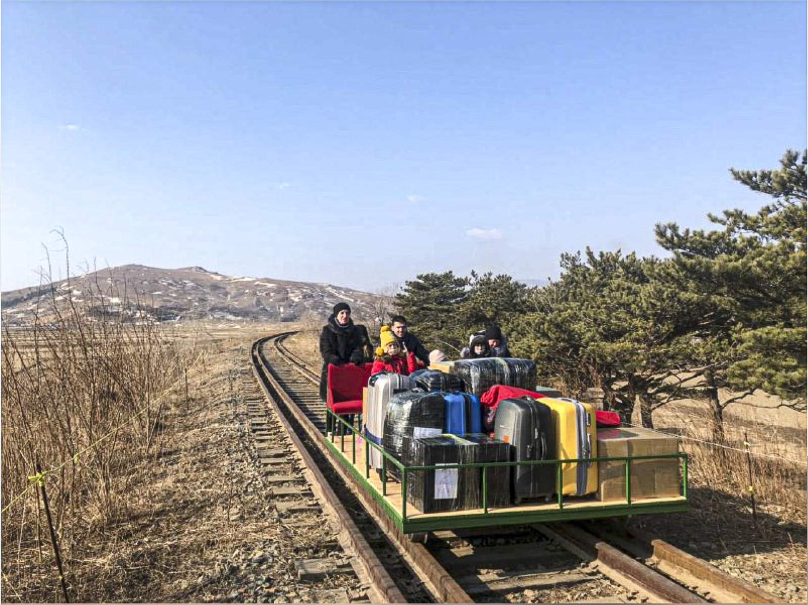 Russian diplomats hand-push trolley over North Korea border