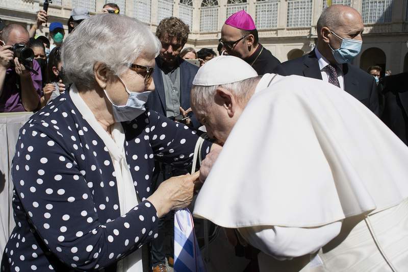 Pope kisses Auschwitz survivor's tattoo