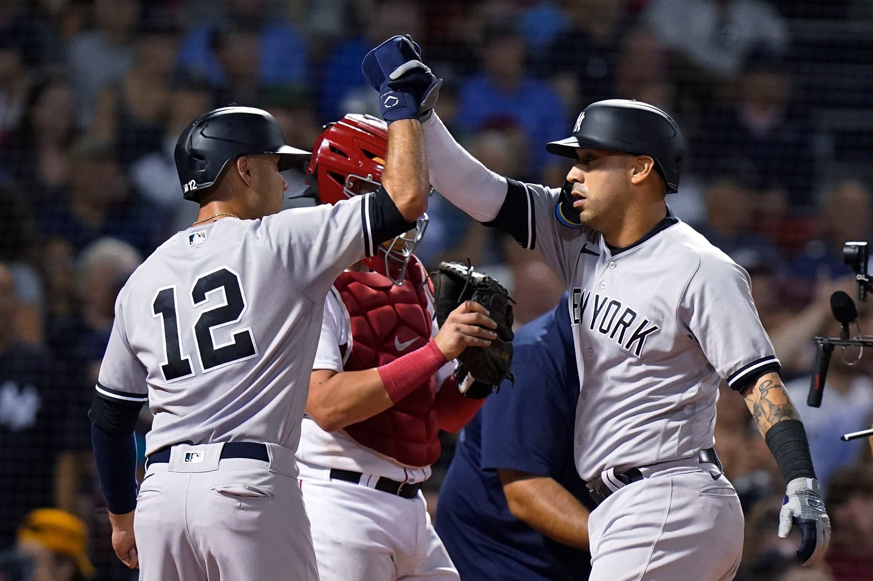 Judge homers twice to reach 57, Yanks beat Sox 7-6 in 10