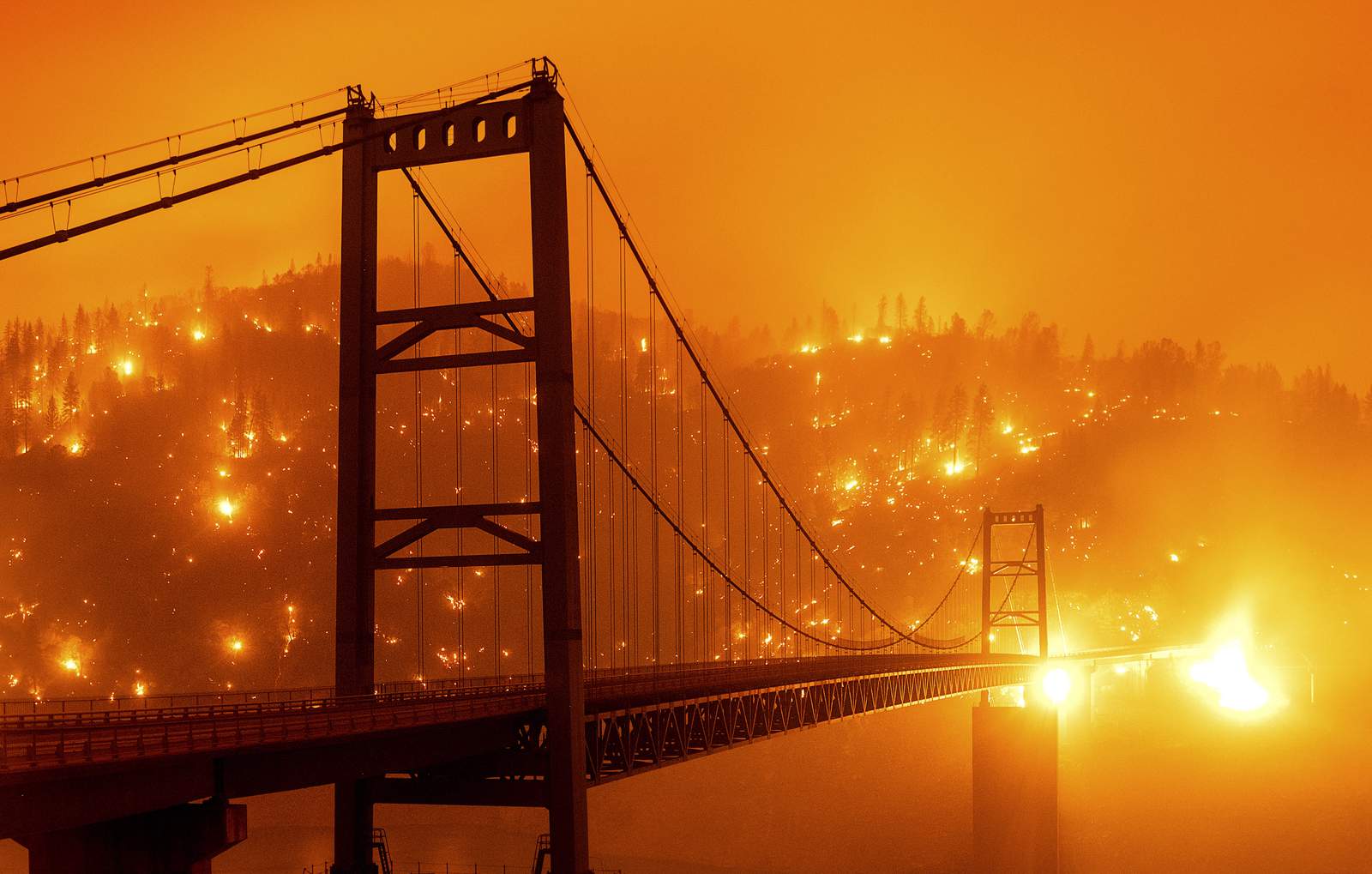 Explosive wildfires across California stoked by fierce winds