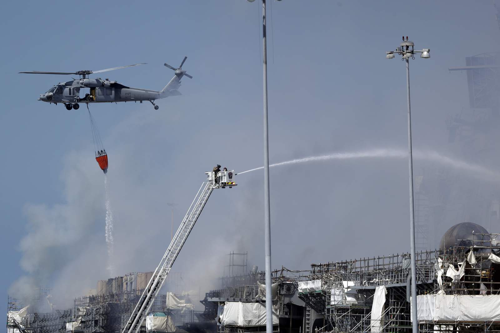 Navy sees progress against blaze on warship in San Diego Bay