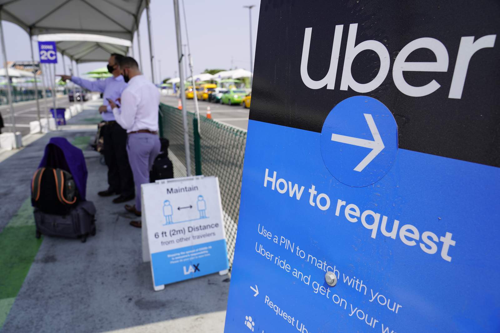 Uber, Lyft spend big, win in California vote about drivers
