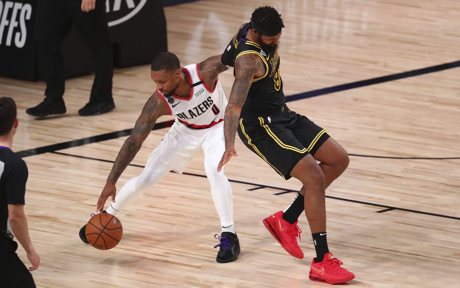 Blazers say Lillard leaving bubble for tests on injured knee