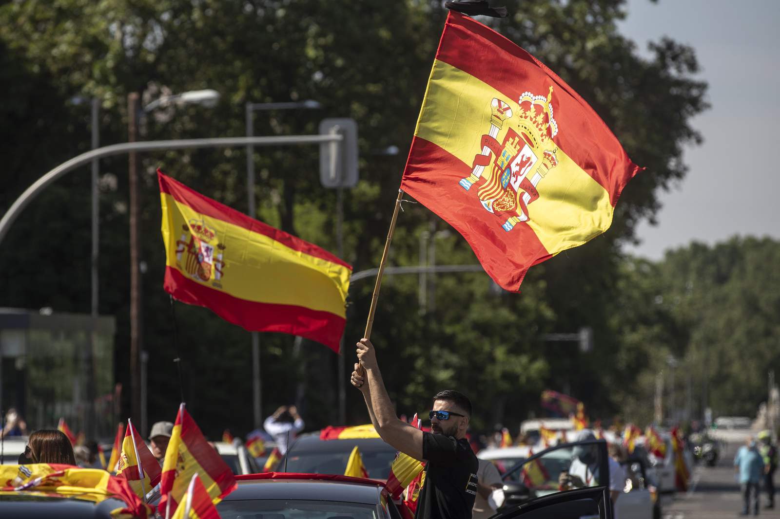 Spains far-right holds car protest against virus lockdown