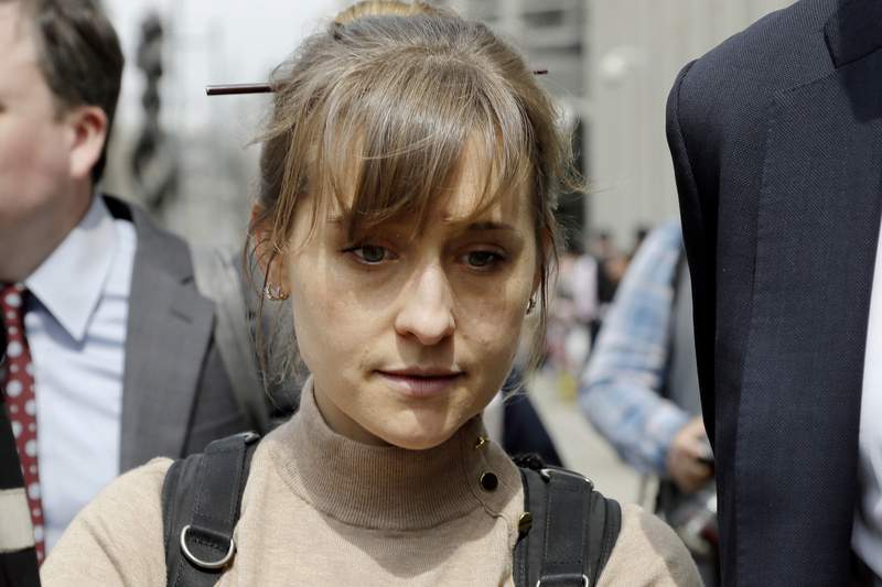 TV actor Allison Mack enters prison in NXIVM sex slave case