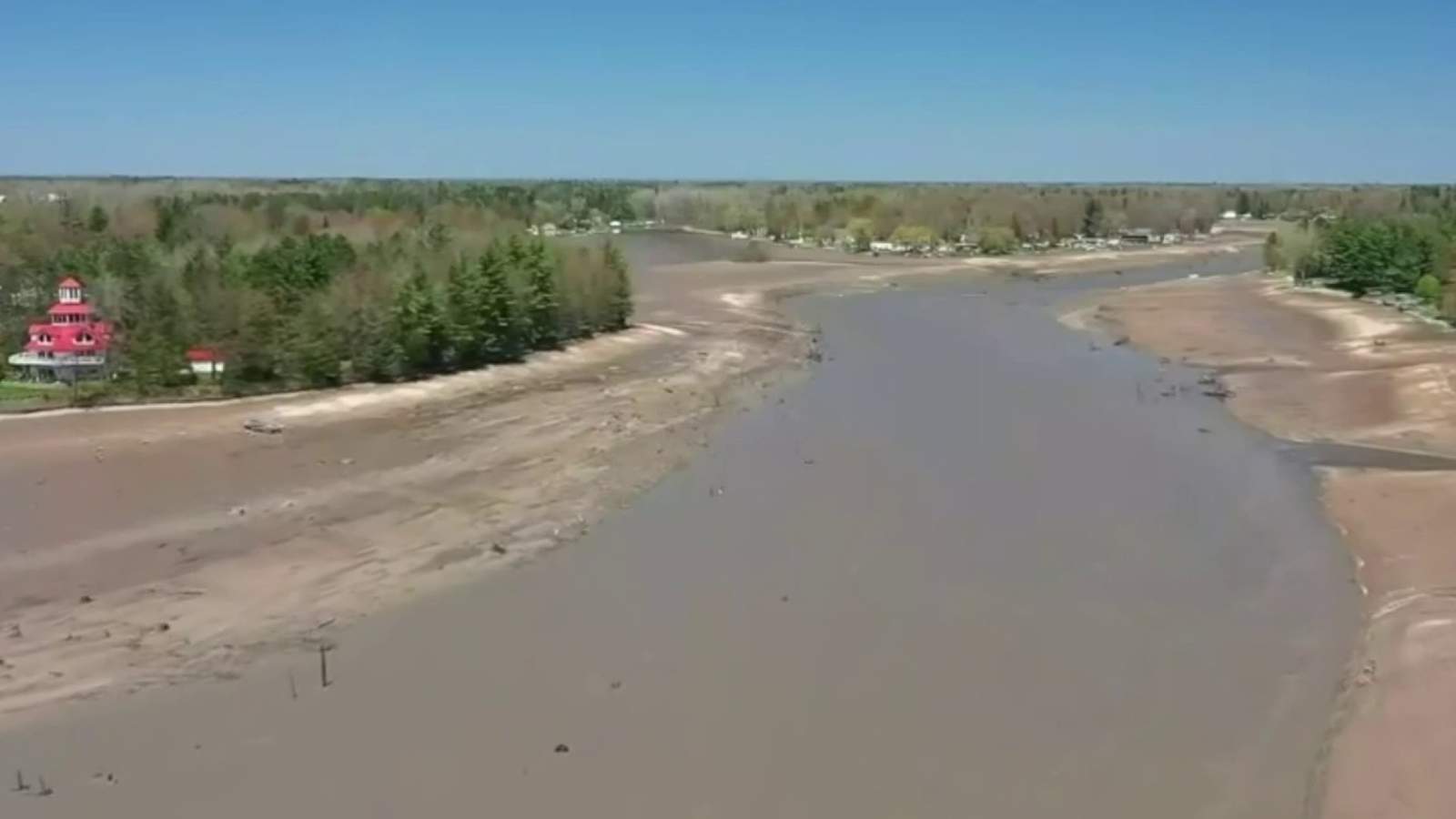 'Devastating. Just Devastating -- Wixom Lake becomes muddy field after dam failures