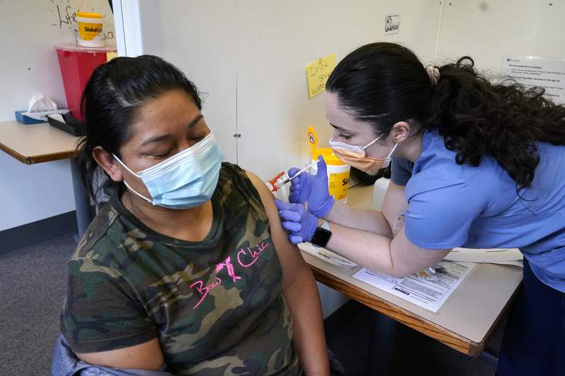 The Latest: Arizona’s state-run vaccination sites to close