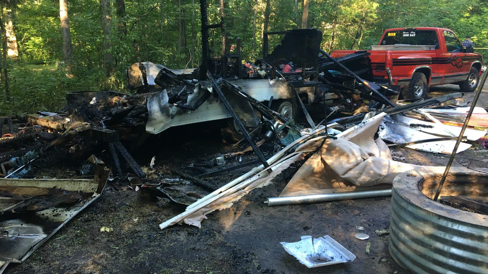 Beulah man burned while helping wife, dog escape camper explosion in Benzie County