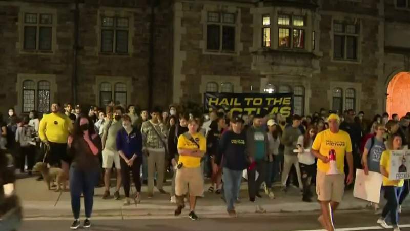 ‘Hail to the victims’: Dozens protest outside University of Michigan president’s Ann Arbor home