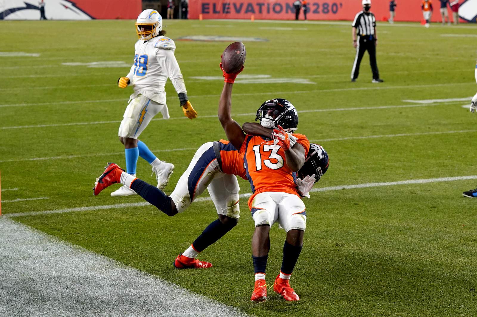 The Latest: Broncos top Chargers on Lock's last-play TD pass