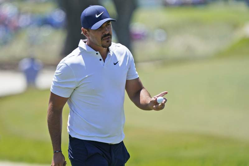 The Latest: Mickelson, Oosthuizen tied for lead at PGA