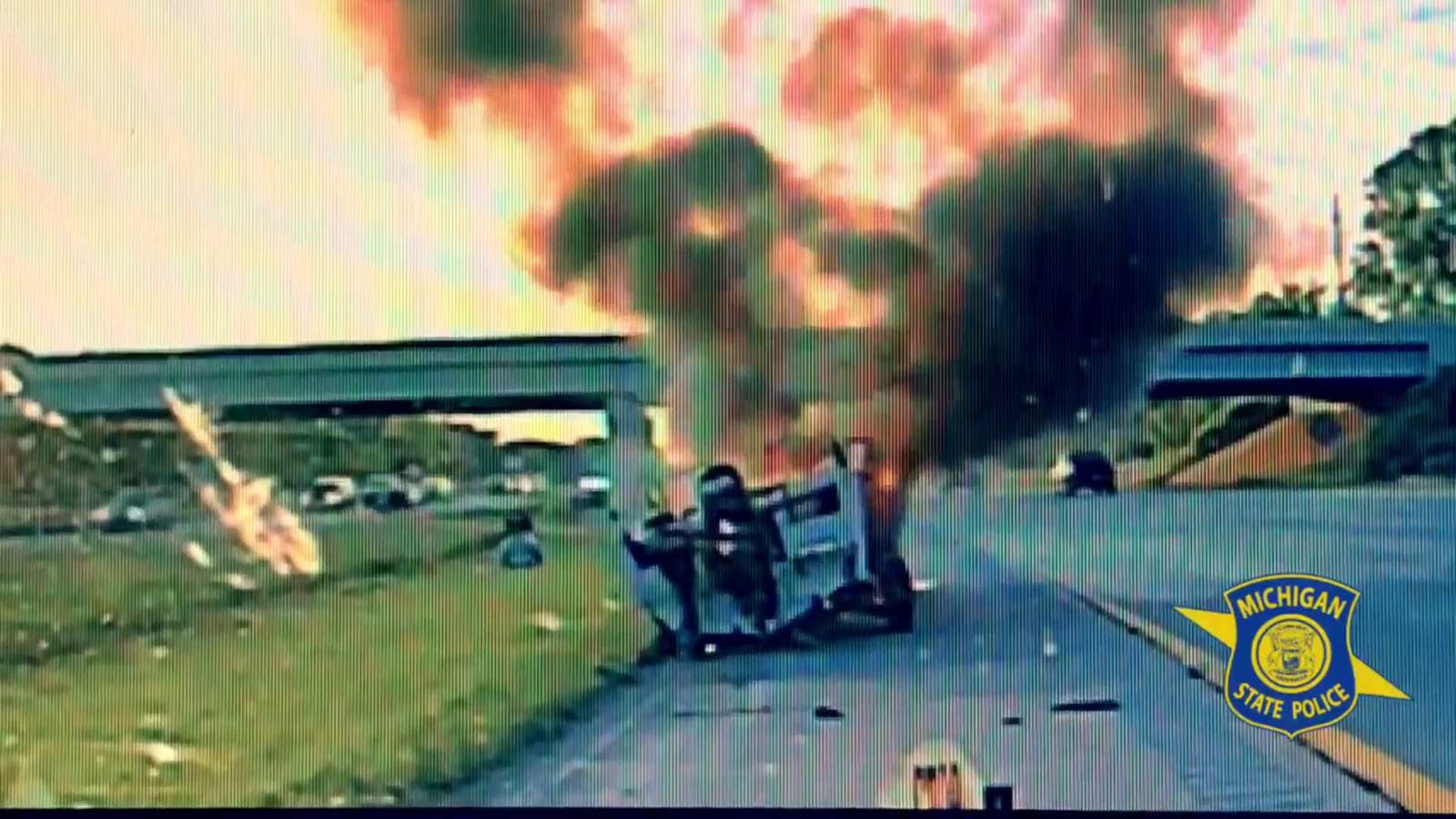 Video shows Michigan state trooper rescue unconscious driver from burning vehicle on I-94