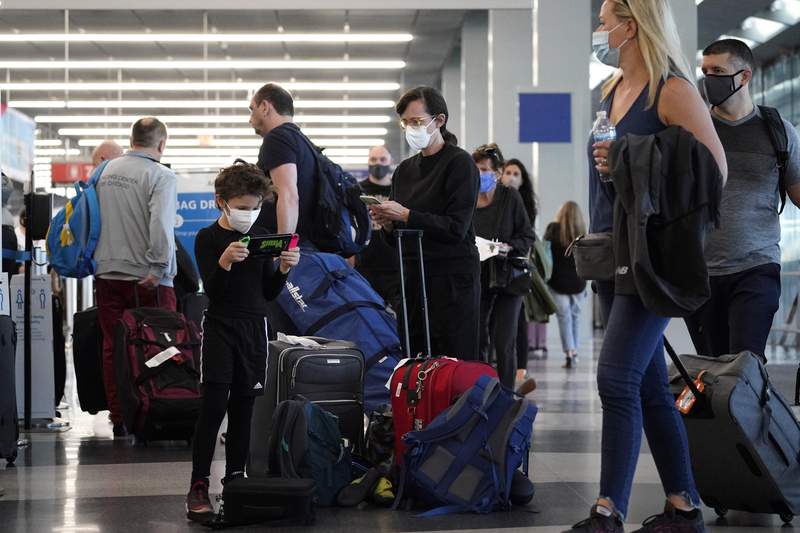 Air travel hits another pandemic high, flight delays grow