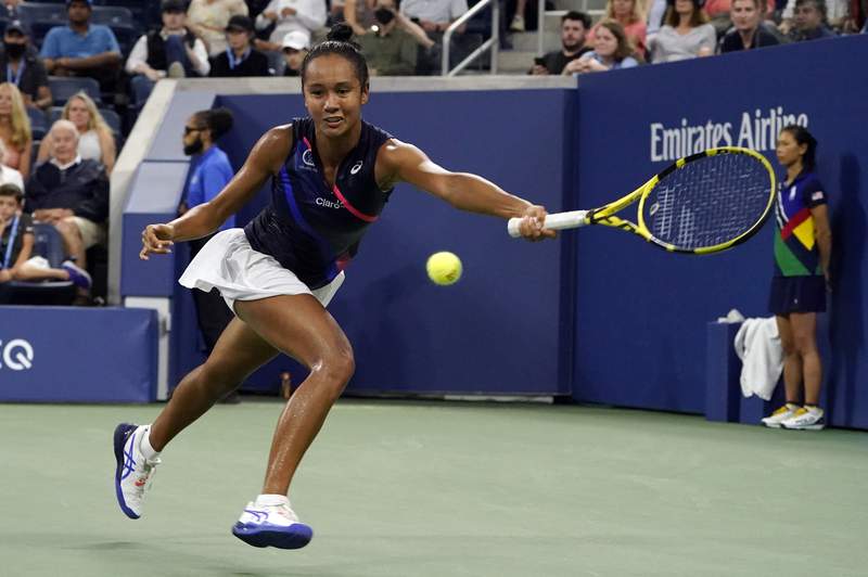 The Latest: Canadian teen Fernandez ousts Kerber at US Open