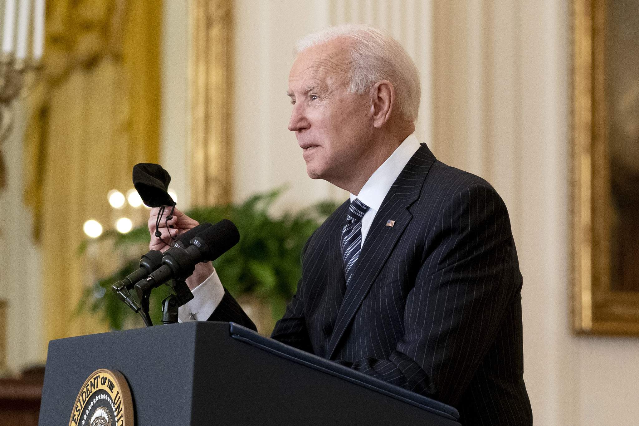 Who deserves credit? Biden leans into pandemic politics