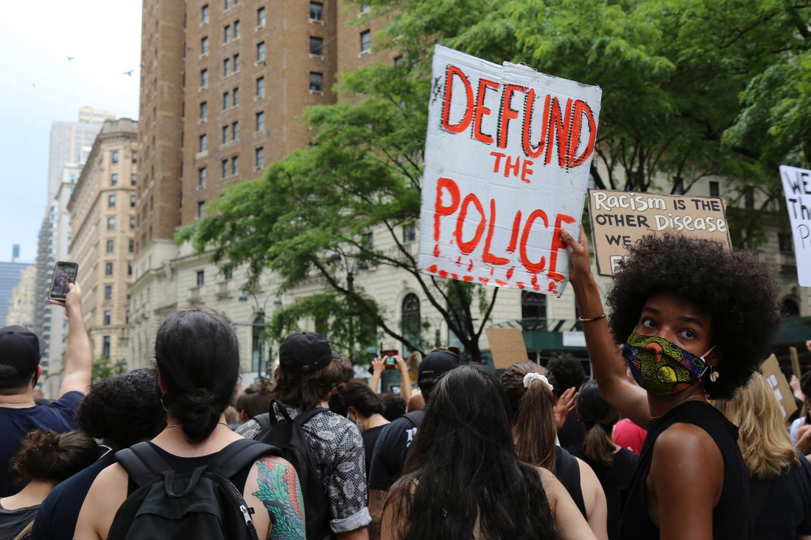 When protesters cry 'defund the police,' what does it mean?