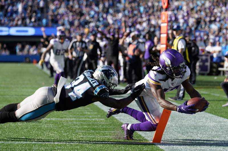 Cousins throws TD pass in OT; Vikings beat Panthers 34-28