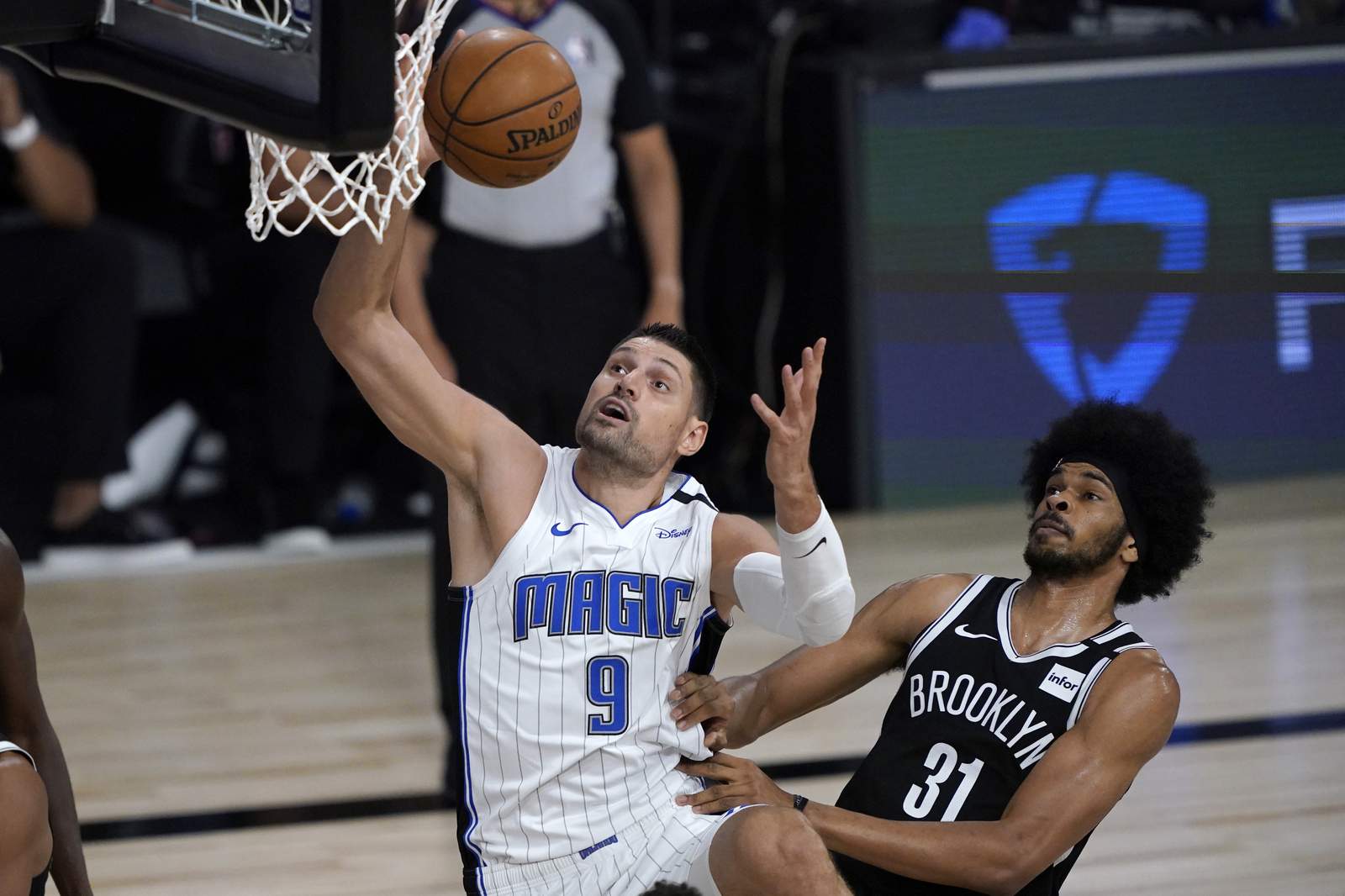 Magic beat Nets 128-118 in restart opener, move up to 7th