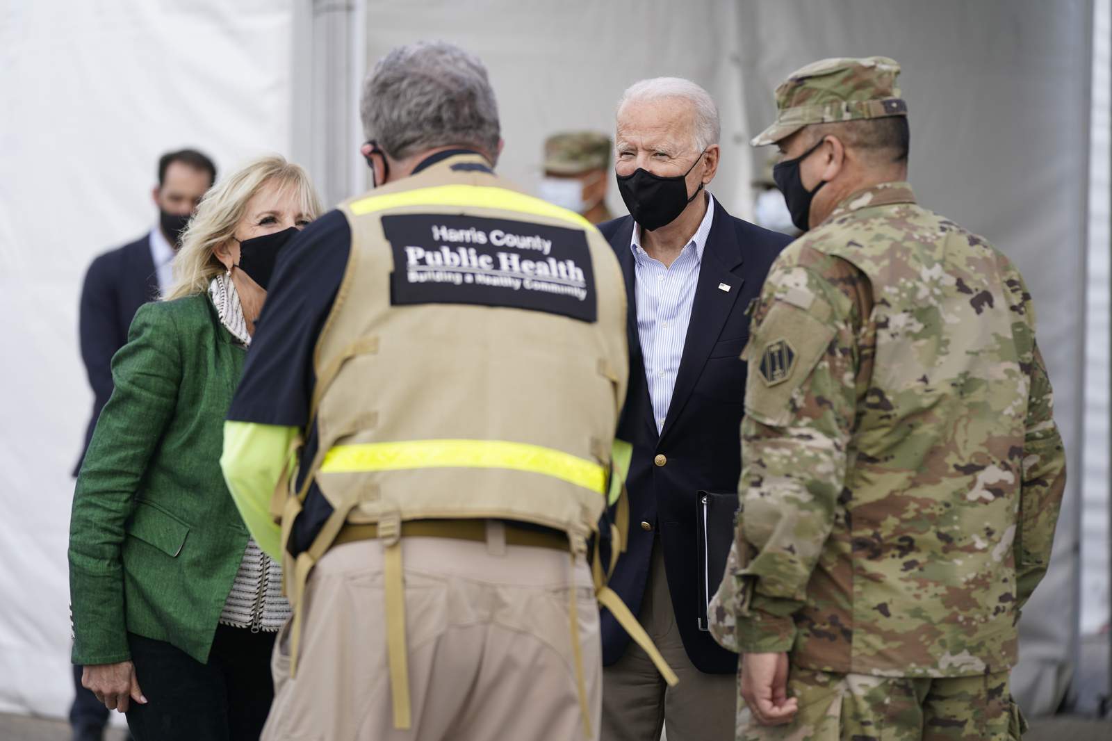 Biden surveys Texas weather damage, encourages virus shots