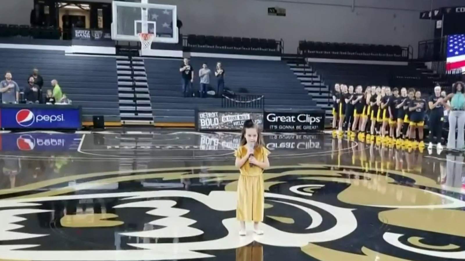 Young girl impresses audience at Oakland University basketball game with rendition of National Anthem