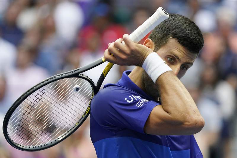 The Latest: Djokovic loses first two sets in US Open final
