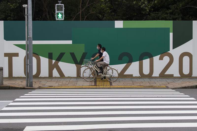 Japan to declare virus emergency lasting through Olympics
