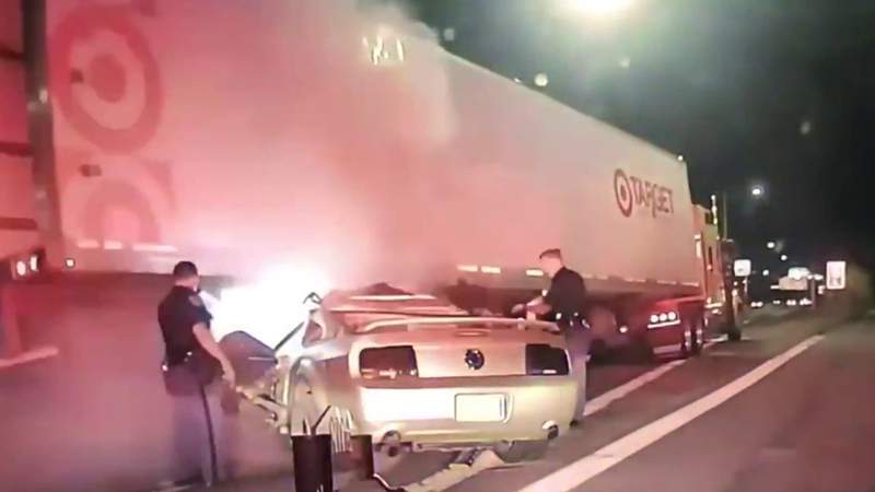Video: Driver in stolen Mustang fleeing Detroit, Michigan State police drives under semi truck trailer