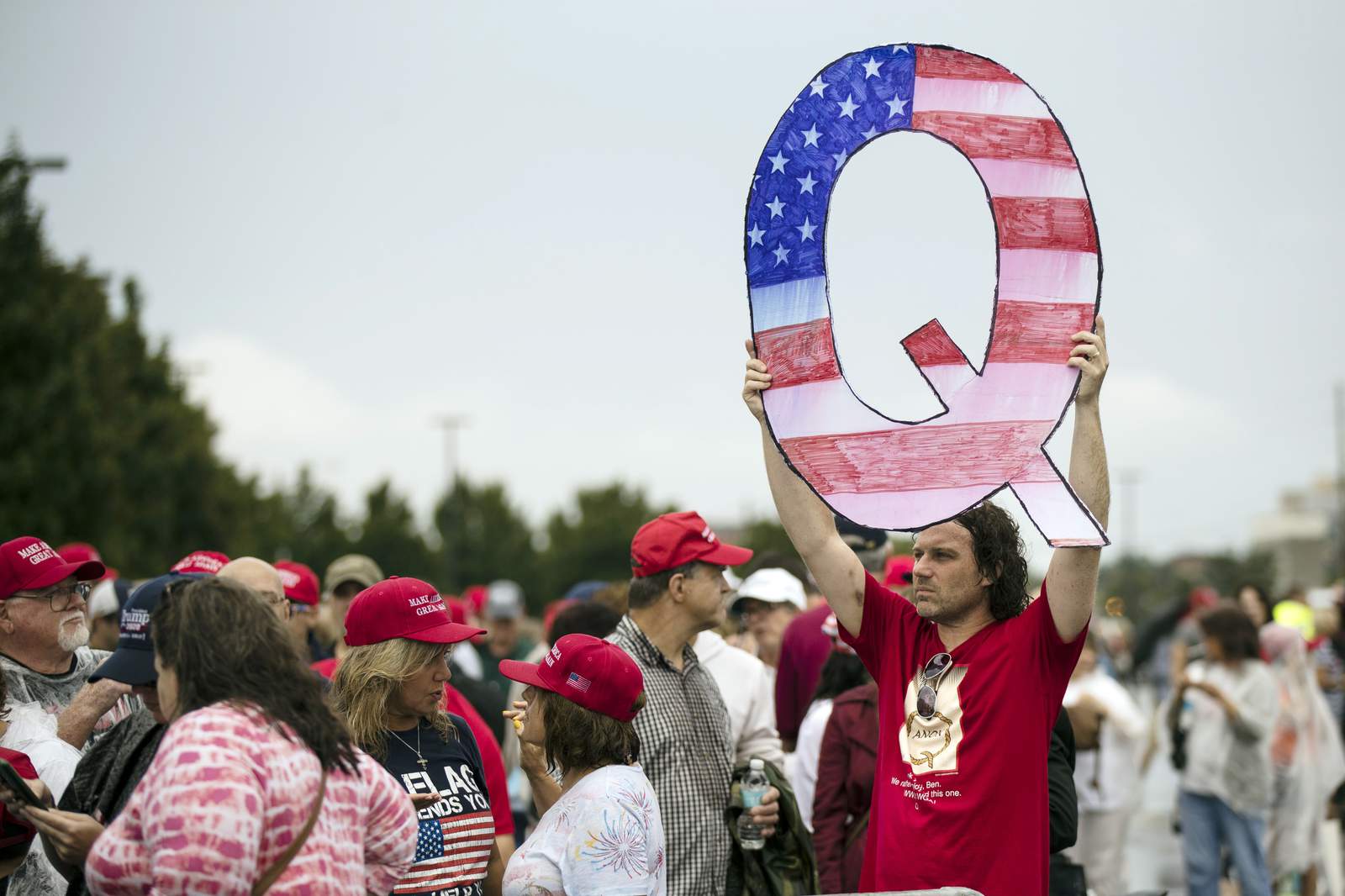 Facebook bans some, but not all, QAnon groups, accounts